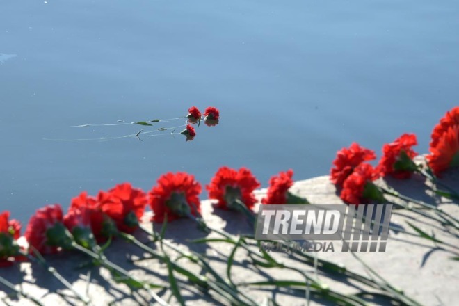 Baku residents bringing flowers to Seaside Boulevard to honor missing oil workers.  Azerbaijan, Dec.07, 2015